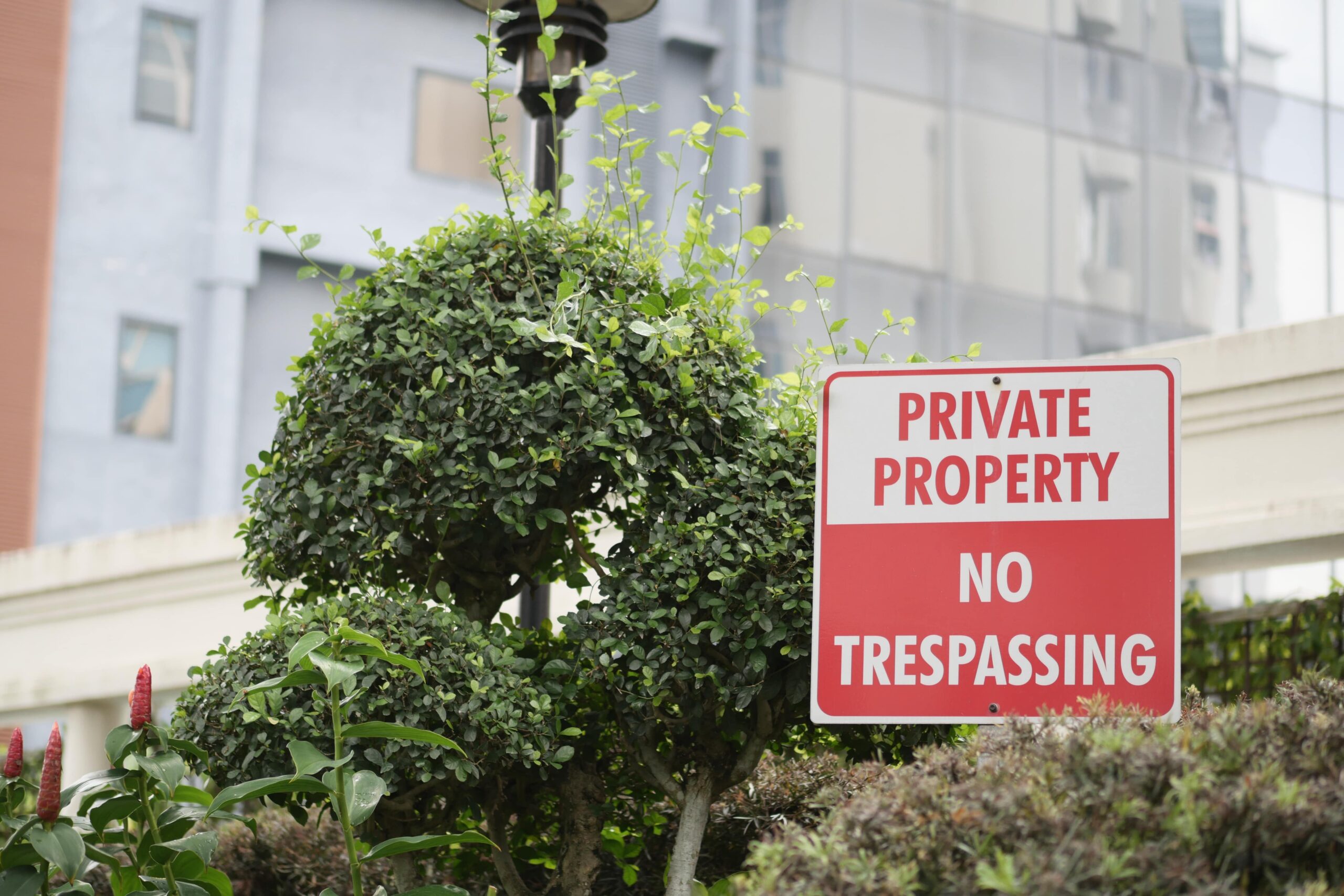 Private property with "No Trespassing" sign, symbolizing defense against unfair condemnation