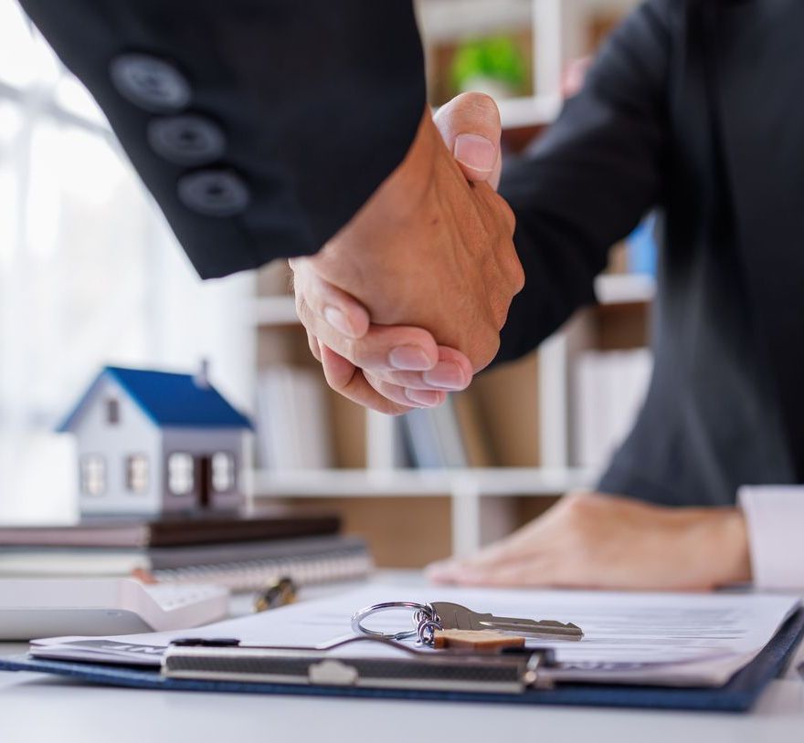 Handshake Real estate brokerage agent Deliver a sample of a model house to the customer, mortgage loan agreement Making lease and buy and sell house And contract home insurance mortgage loan concept