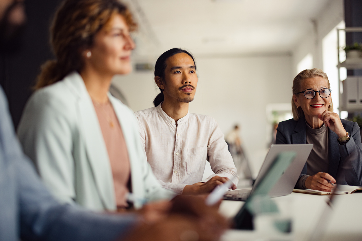 Diverse Business Team Engaged In Office Meeting Discussion