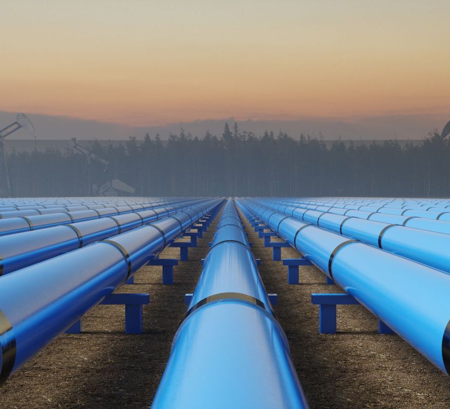 Blue Pipeline Infrastructure at Sunset in Industrial Oil Field